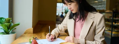 Candidate filling job form in cafe Candidate filling job form in cafe